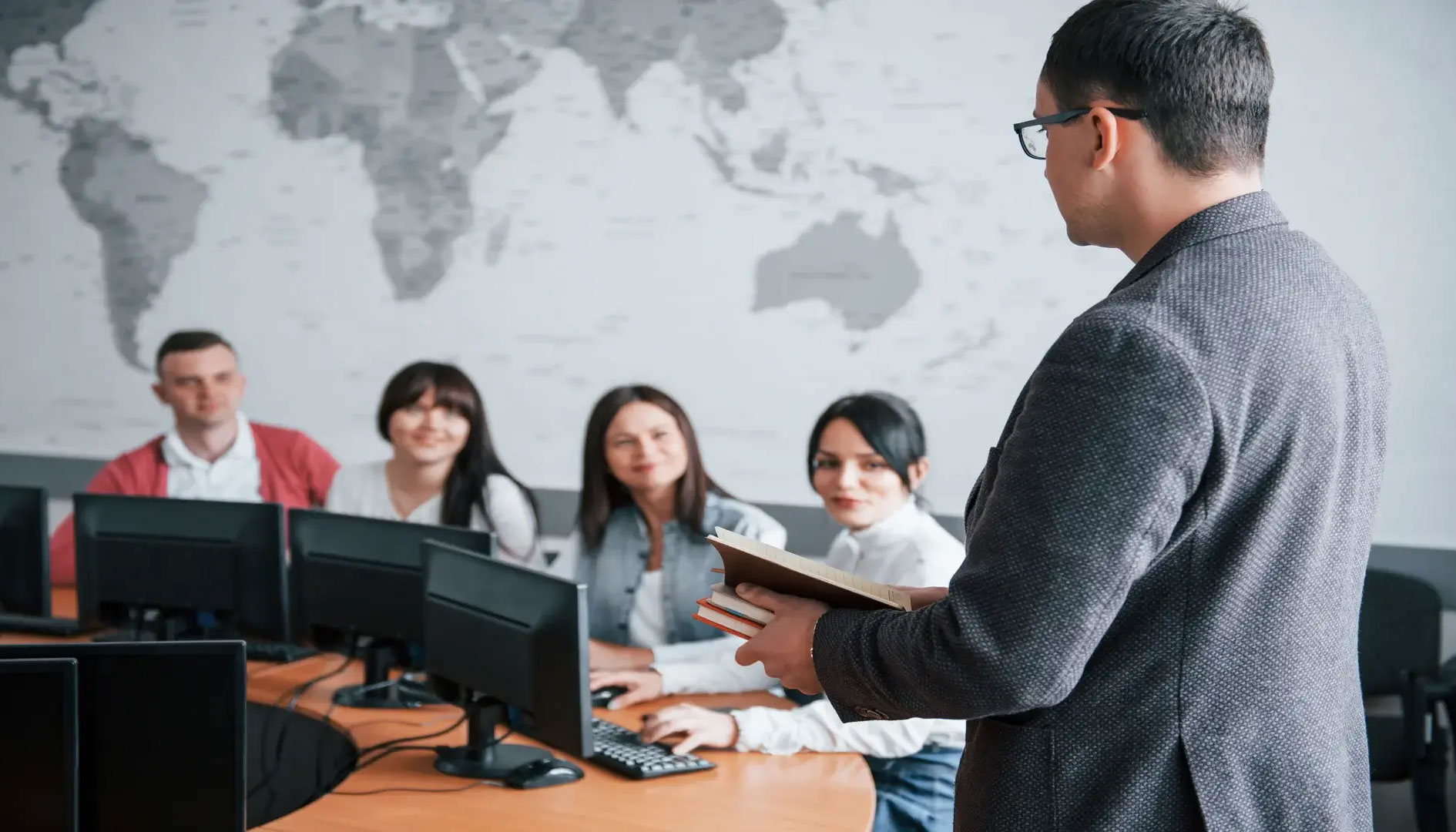 A man standing in front of several people.