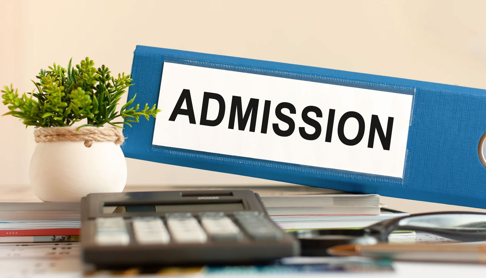 A blue box with the word admission on it