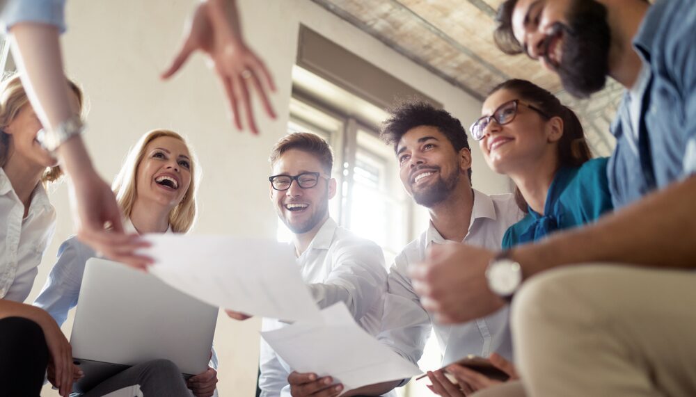 A group of people standing around each other.